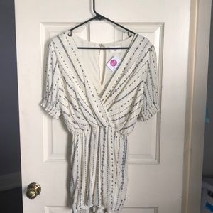 Cream romper with navy design